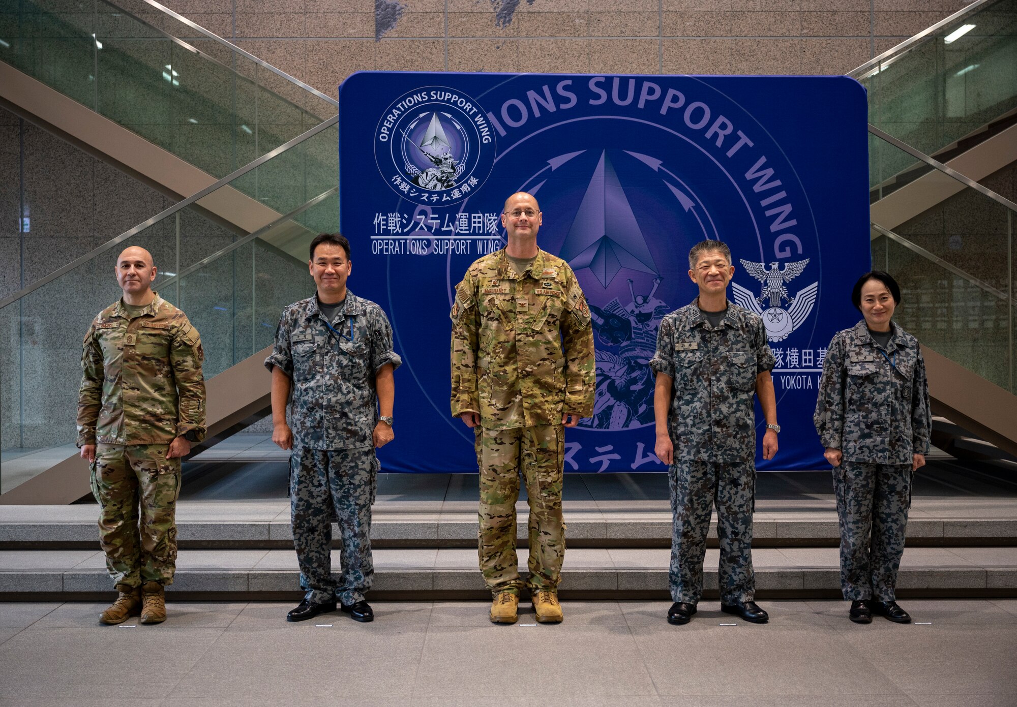 U.S. and Japanese military members pose for a photo.