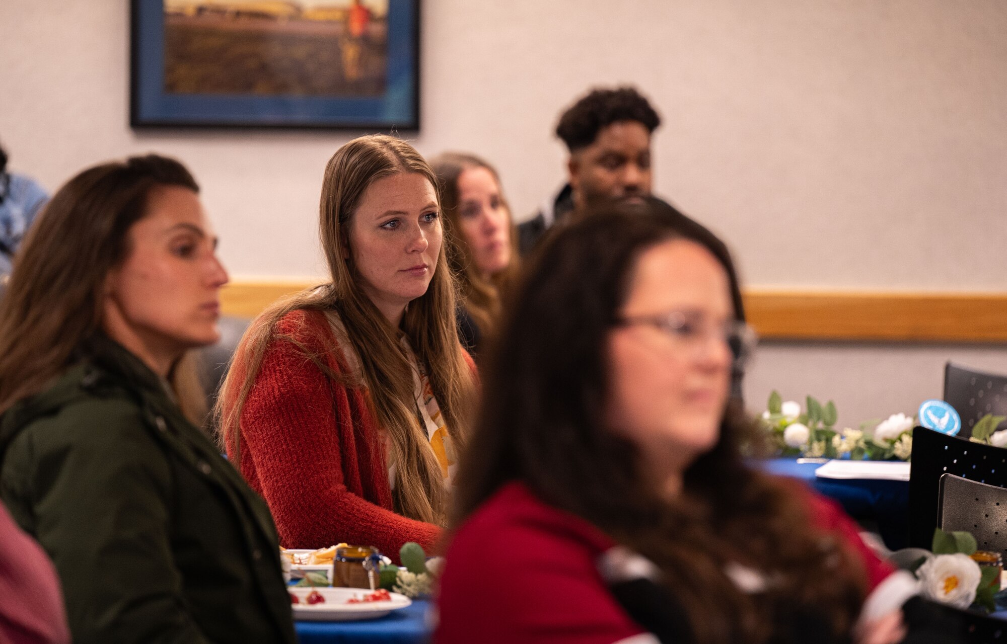 A Key Support Liaison from the 100th Air Refueling Wing listens to a speaker at the Key Support Liaison Symposium at Royal Air Force Mildenhall, England, Oct. 1, 2024.
