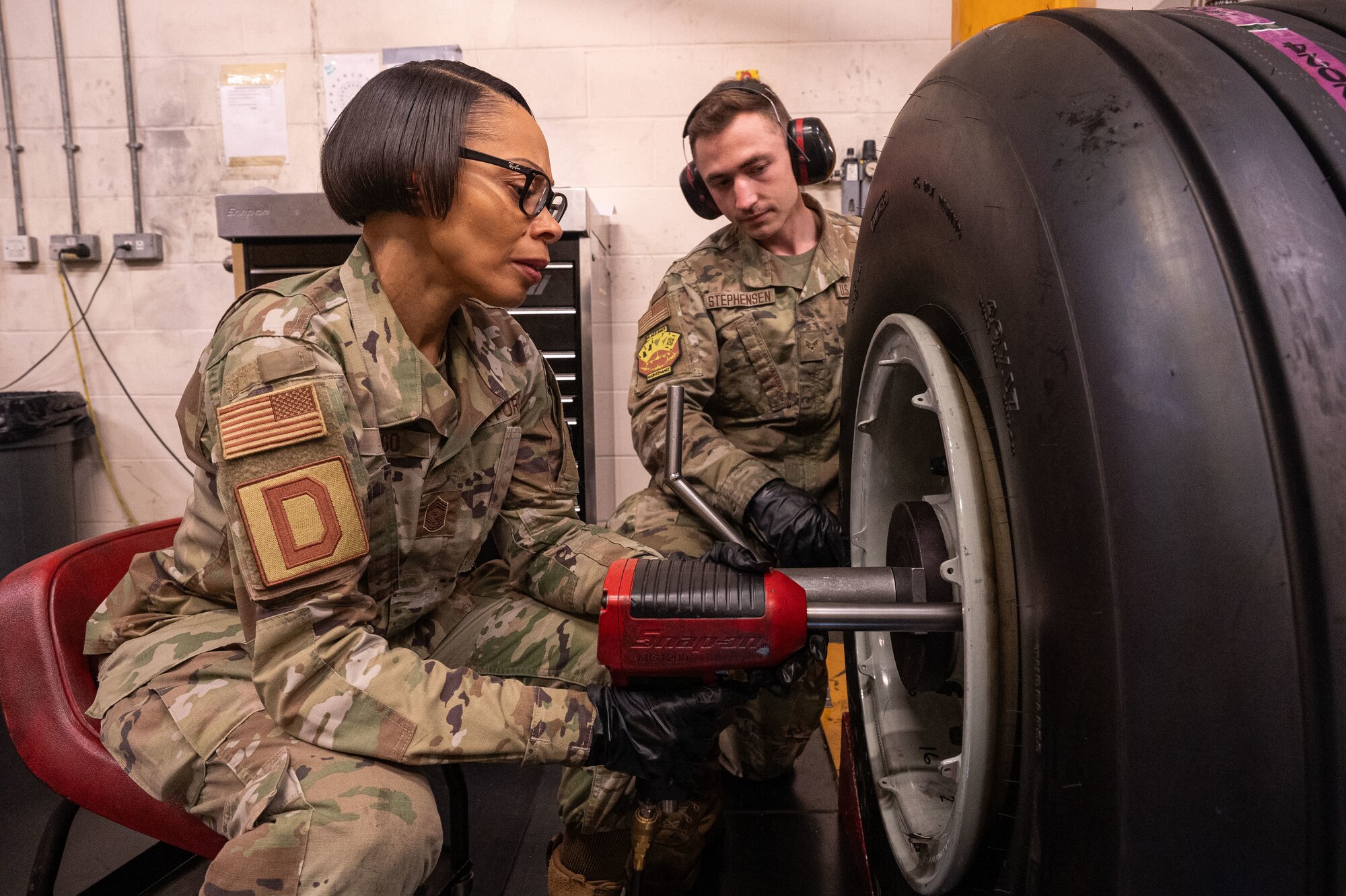 U.S. Air Force Chief MSgt. Tiffany Griego, 100th Air Refueling Wing command chief, tightens bolts joining the wheelbase of a KC-135 Stratotanker at Royal Air Force Mildenhall, England, Oct. 4, 2024.