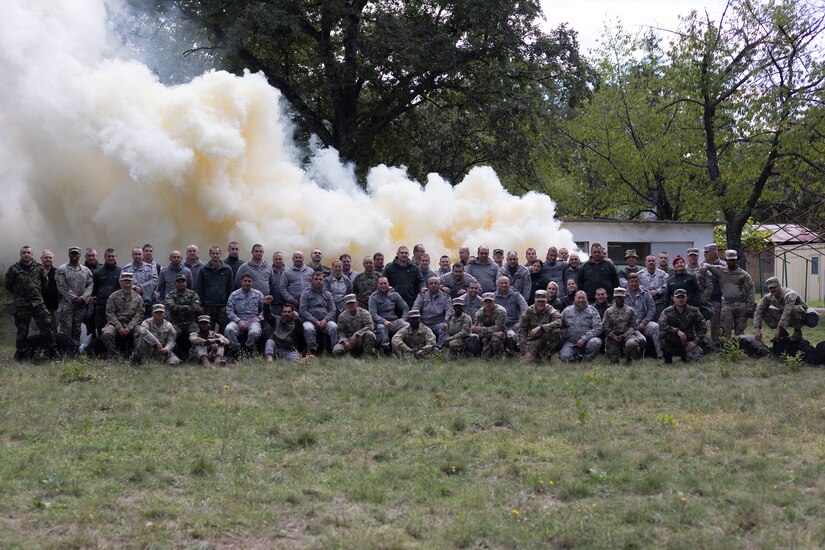 U.S. Army chemical, biological, radiological, and nuclear (CBRN) specialists assigned to 317th Brigade Engineer Battalion, 3rd Brigade Combat Team, 10th Mountain Division (Light Infantry), and Bulgarian Armed Forces CBRN specialists pose for a photo during joint CBRN defense training between the U.S. Army and Bulgarian Armed Forces at Novo Selo Training Area, Bulgaria, Oct. 1, 2024. The training improved collaboration, communication, and operational readiness between allied forces, strengthening their ability to jointly respond to CBRN threats in multinational missions. (U.S. Army photo by Spc. Alexcia Rupert)