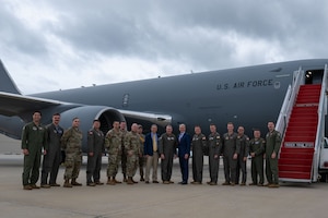 U.S. Air Force Maj. Gen. Charles D. Bolton, 18th Air Force commander, Chief Master Sgt. Thomas Blount, 18th Air Force command chief, Aaron Tucker, Major Defense Acquisition Programs director, and the Honorable Peter Beshar, U.S. Department of the Air Force general counsel, pose for a photo with air crew assigned to the 305th Air Mobility Wing during an east coast introductory base tour at Joint Base McGuire-Dix-Lakehurst, N.J., Sept. 26, 2024. The senior leaders concluded their regional tour with the ‘Can Do’ wing as they visited several bases for the first time since taking command, while Beshar joined the team at JB MDL to gain more insight about the KC-46A Pegasus aircraft fleet and what the jet provides in comparison to legacy tankers. (U.S. Air Force photo by Staff Sgt. Monica Roybal)