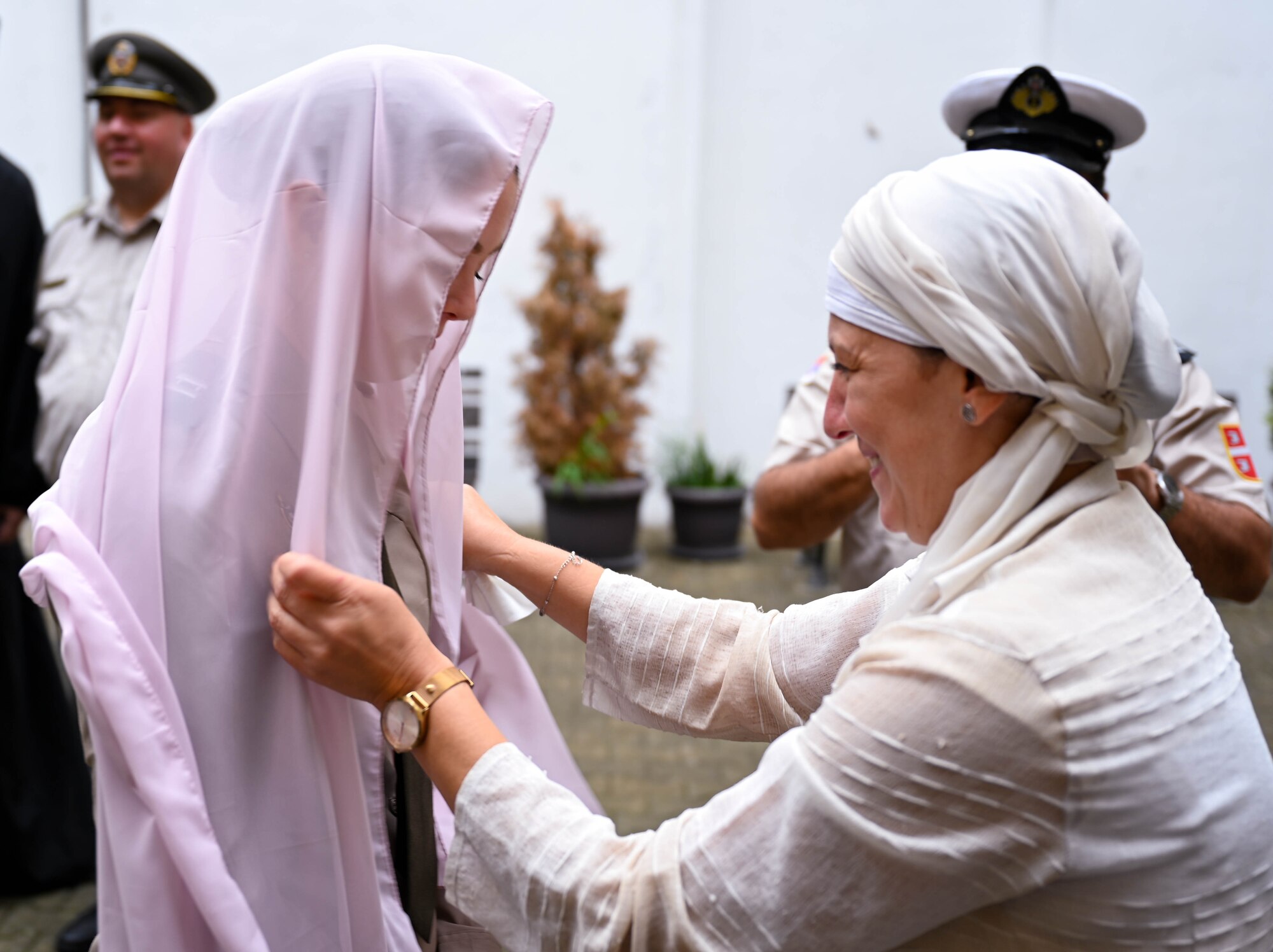 U.S. Army Capt. Kelsee Jordan, Battalion Chaplain for the 134th Field Artillery Regiment, gets fitted for a hijab at the Bajrakli Mosque in Belgrade, Serbia, Sept. 13, 2024. The State Partnership Program between the Ohio National Guard and Serbia aims to strengthen relationships that enhance global security, understanding and cooperation between the two partners. (U.S. Air National Guard photo by Airman 1st Class Josh Kaeser)