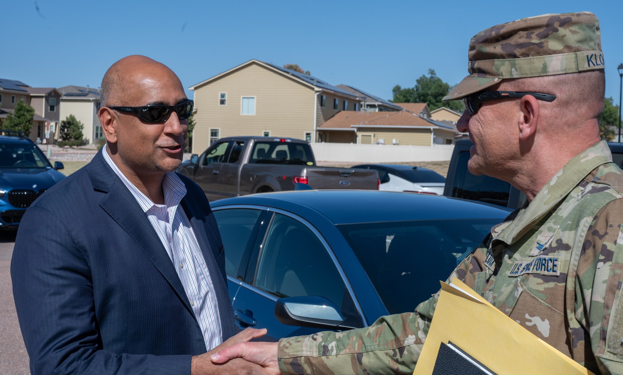 Dr. Ravi Chaudhary shakes hand with Col. Klock as they greet each other at the beginning of the tour.