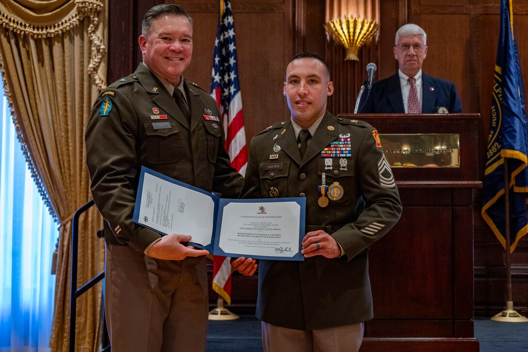 U.S. Army Brig. Gen. John Pippy, director of the joint staff of the Pennsylvania National Guard, and Master Sgt. Figueroa, Recruiting and Retention NCO for team Philadelphia stands for a photo after accepting the Major Octavius V. Catto Medal at The Union League of Philadelphia, October 5, 2024. Catto was a Civil War-era Pennsylvania militia officer who was killed in Philadelphia in 1871 while on duty defending African-Americans at polling places from those who opposed their right to vote. An annual award in his name is given to Pennsylvania National Guard members who distinguish themselves as leaders through community support and public service.