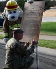 U.S. Air Force Col. Craig Bailey, 9th Maintenance Group commander, signs the Fire Prevention Week proclamation at Beale Air Force Base, California, Oct. 6, 2024.