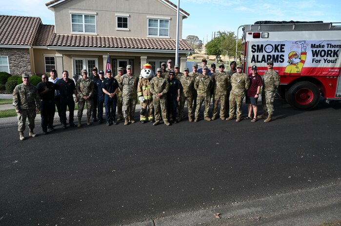 Beale's first responders and 9th Reconnaissance Wing members pose for a group photo during the kickoff of Fire Prevention Week at Beale Air Force Base, California, Oct. 6, 2024.