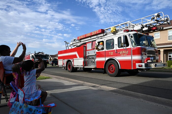 Beale's first responders perform a parade of vehicles around base housing with their sirens blaring to kick off Fire Prevention Week at Beale Air Force Base, California, Oct. 6, 2024.