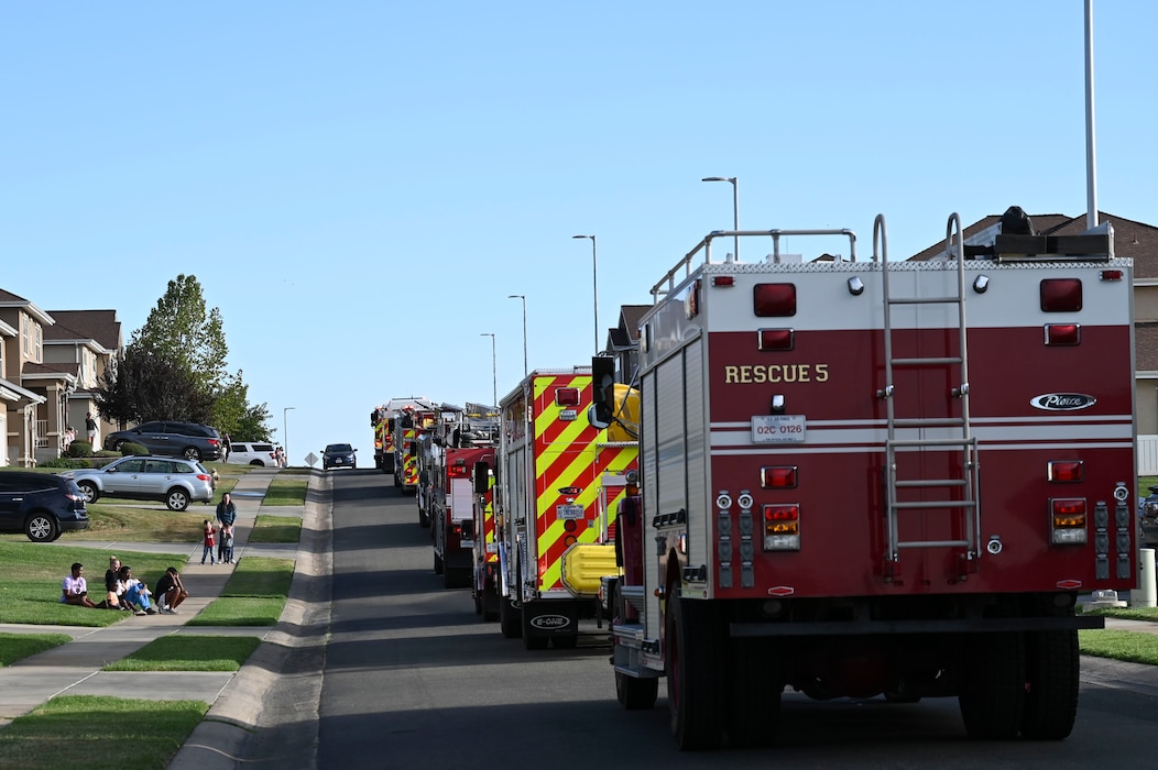 Beale's first responders perform a parade of vehicles around base housing with their sirens blaring to kick off Fire Prevention Week at Beale Air Force Base, California, Oct. 6, 2024.