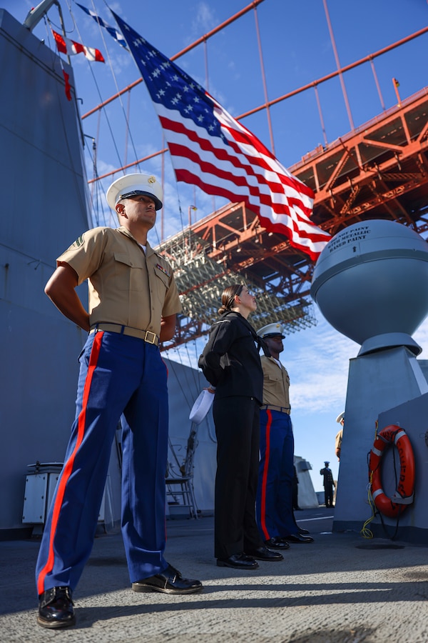 U.S. Marines and Sailors assigned to the 15th Marine Expeditionary Unit, 1st Marine Logistics Group, and the amphibious transport dock USS Somerset (LPD 25), man the rails as Somerset transits underneath the Golden Gate Bridge in support of San Francisco Fleet Week 2024, Oct. 6, 2024. San Francisco Fleet Week, now in its 43rd iteration, is a time-honored sea service celebration that allows citizens of the Bay Area to witness today’s maritime capabilities firsthand. Nearly 2,500 Sailors, Marines, and Coast Guardsmen will showcase their capabilities and equipment, participate in various community service events, and enjoy the hospitality of the Bay Area during the event. (U.S. Marine Corps photo by Cpl. Aidan Hekker)