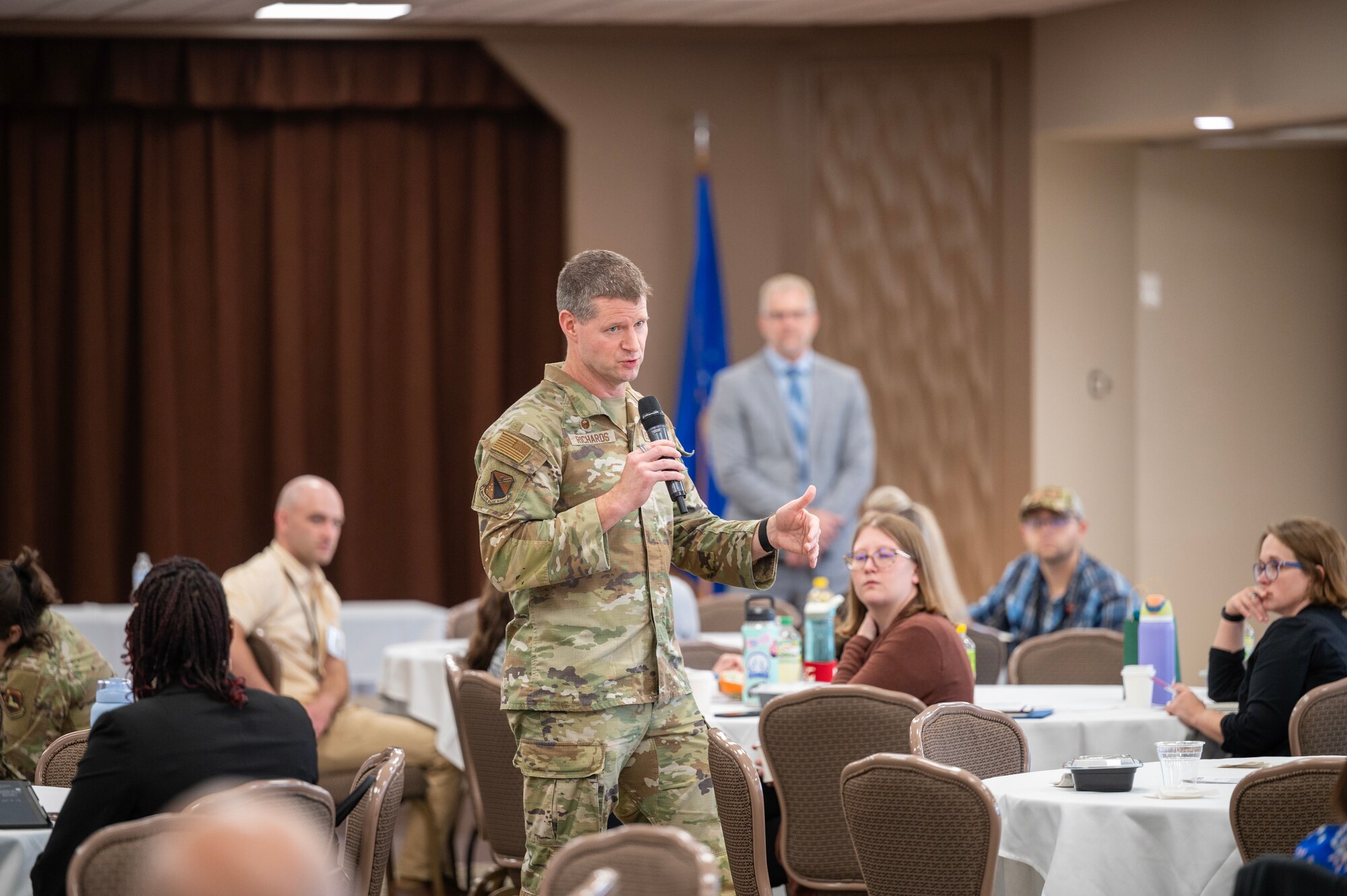 Col. Dustin Richards, 88th Air Base Wing Commander, speaks to attendees at the Wright-Patt Junior Force Council Annual Leadership Symposium