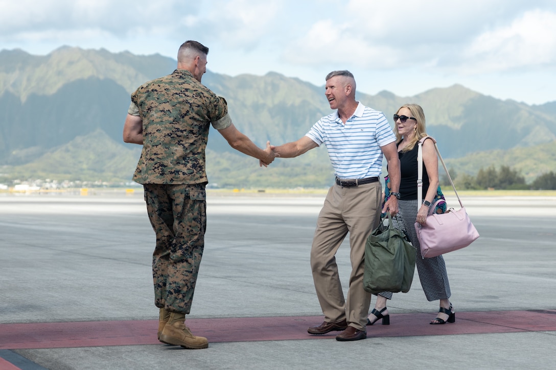 The 39th Commandant of the Marine Corps, Gen. Eric M. Smith, right, is greeted by Col. Jeremy Beaven, commanding officer, Marine Corps Base Hawaii, during his visit to MCBH, Sept. 11, 2024. The CMC and Sergeant Major of the Marine Corps, Carlos A. Ruiz, visited MCBH to participate in the Marine Forces Pacific change of command ceremony. (U.S. Marine Corps photo by Cpl. Clayton Baker)