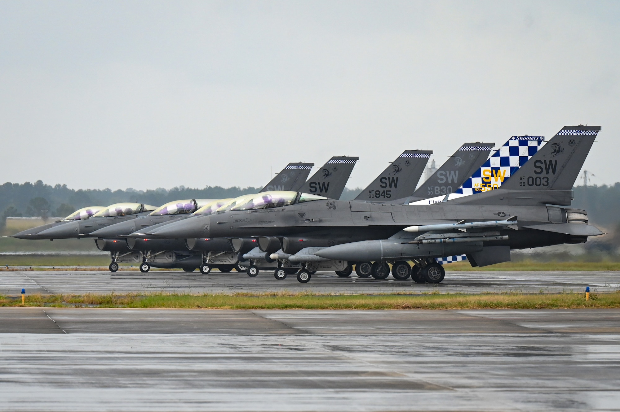 Six jets getting ready to take off.