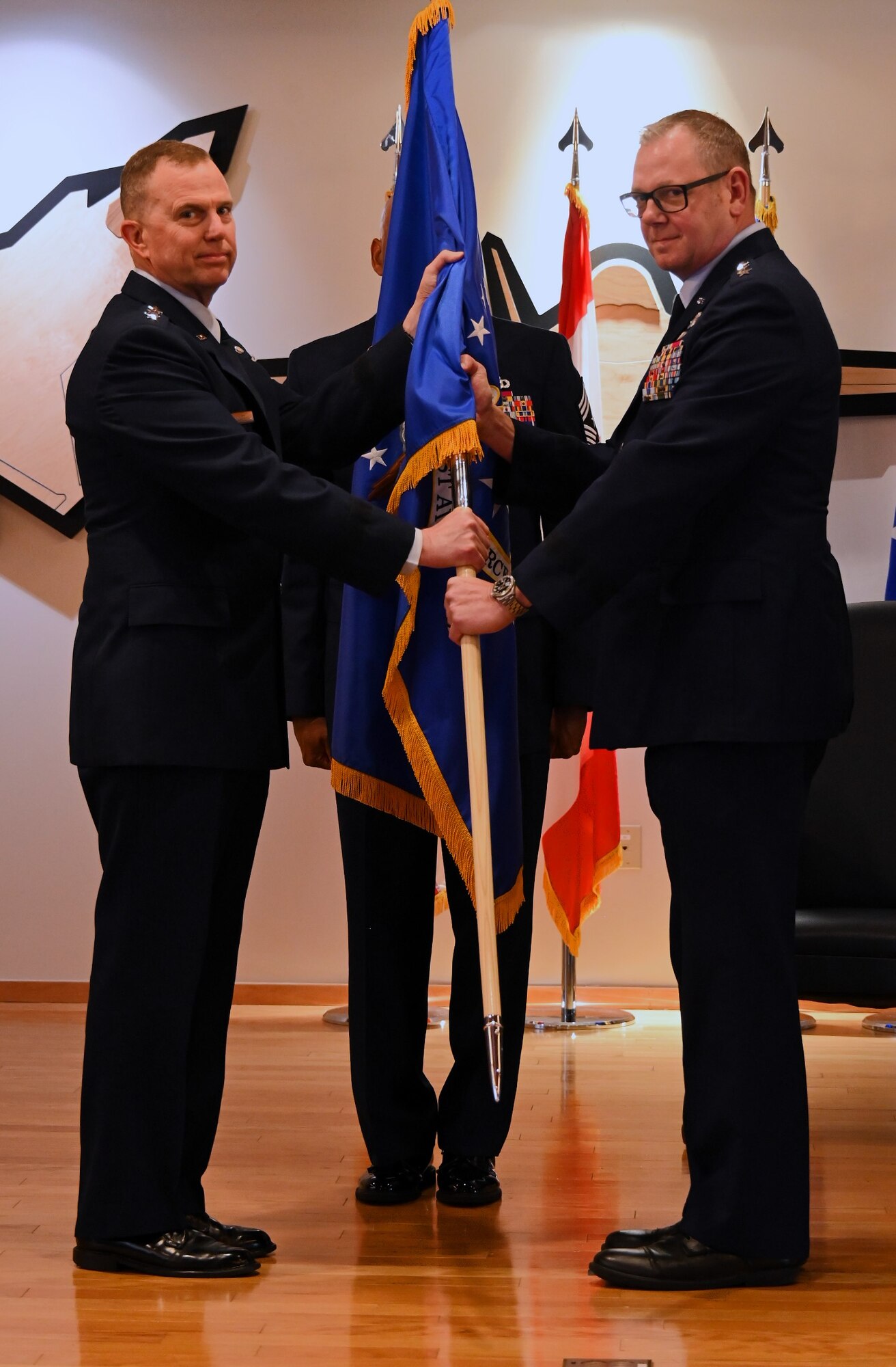 Change of Command for First Air Force. Images show the handoff from Lt. Gen. Steven Nordhaus to Lt. Gen. Luke Ahmann.
