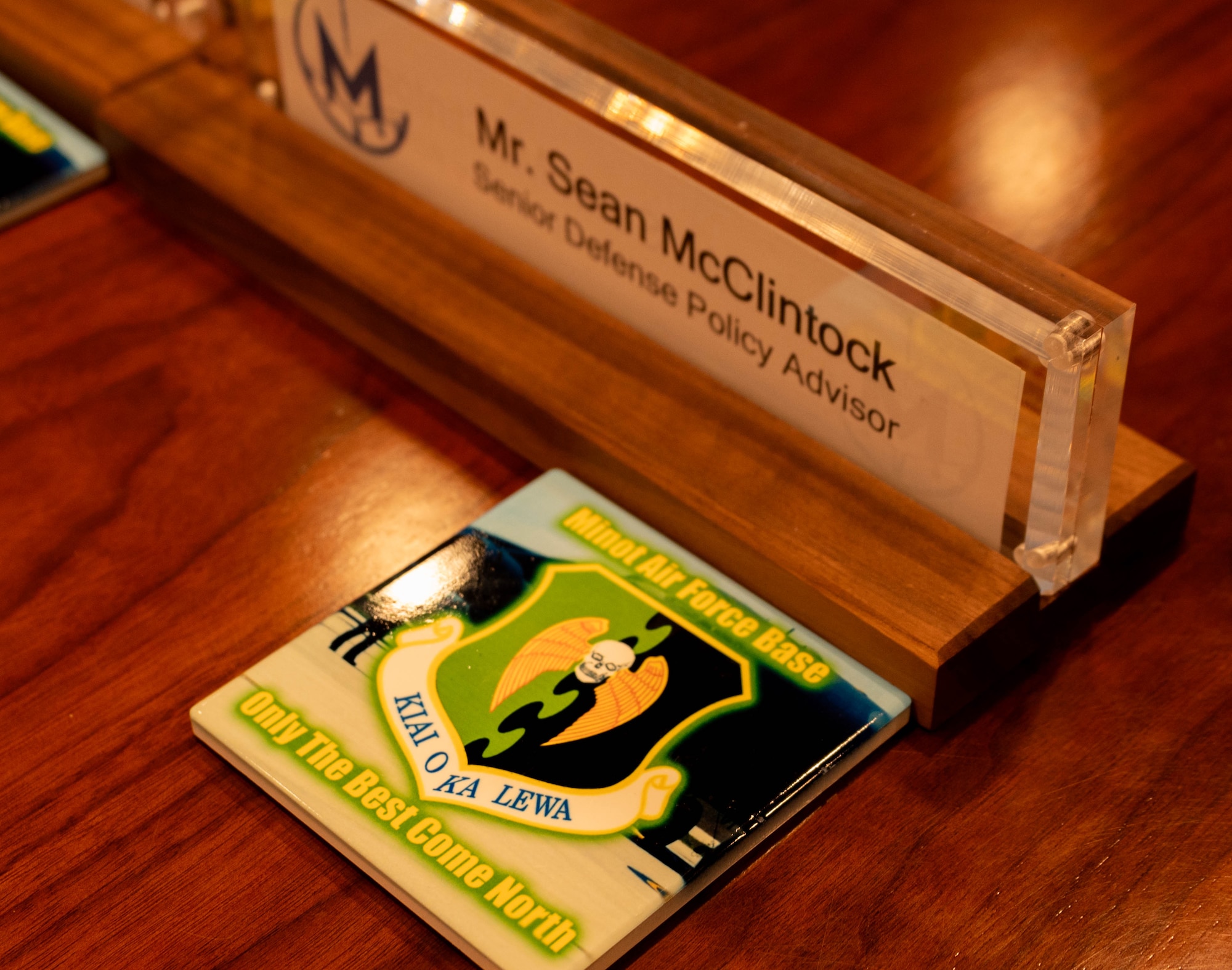 A nameplate and coaster displayed before the Congressional Staff Delegation (STAFFDEL) welcome brief at Minot Air Force Base, Oct. 2, 2024. The visit provided an opportunity for Minot AFB to showcase the strategic mission to the STAFFDELs. (U.S. Air Force photo by Airman 1st Class Luis Gomez)