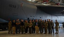 Team Minot Airmen assigned to the 5th Munitions Squadron, U.S. Air Force Col. Jesse Lamarand, 5th Bomb Wing commander, and the Congressional Staff Delegation (STAFFDEL) pose for a group photo in front of a B-52H Stratofortress at Minot Air Force Base, North Dakota, Oct. 2, 2024. STAFFDELs are crucial because members of Congress frequently depend on their insights and recommendations when making decisions about key legislative matters. (U.S. Air Force photo by Airman 1st Class Luis Gomez)