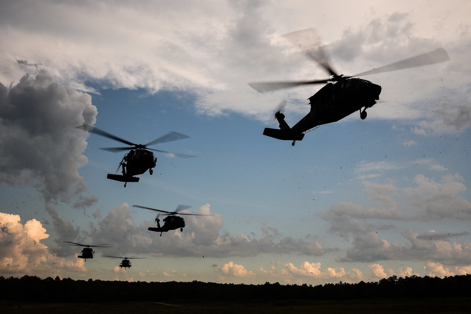 Virginia National Guard Soldiers assigned to Charlie Troop, 2nd Squadron, 183rd Cavalry Regiment, 116th Infantry Brigade Combat Team conduct an air assault with support from air assets from 2nd Battalion, 224th Aviation Regiment, 29th Infantry Division July 21, 2019, during eXportable Combat Training Capability Rotation 19-4 at Fort Pickett, Virginia. Read more about the XCTC at go.usa.gov/xyPx6. (U.S. Army National Guard photo by Sgt. 1st Class Terra C. Gatti)