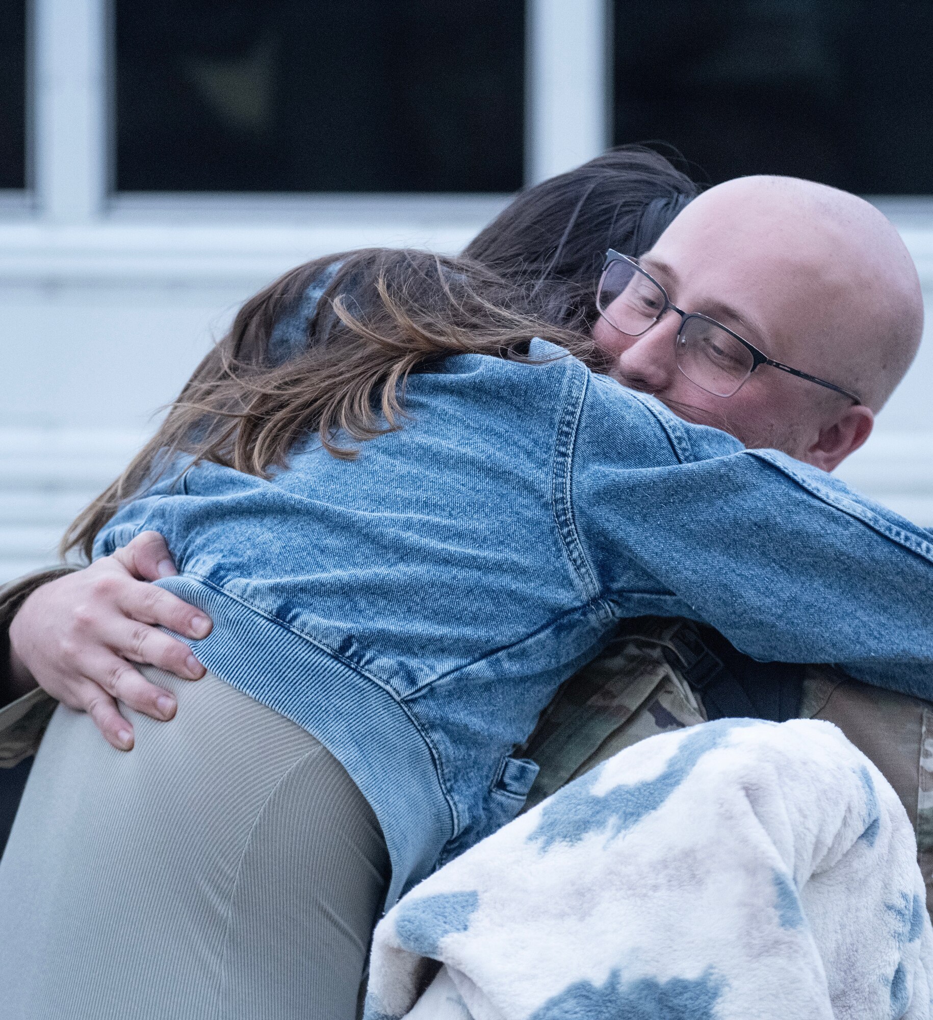 A U.S. Air Force Airman assigned to the 4th Comptroller Squadron reunites with his wife after returning from a deployment.