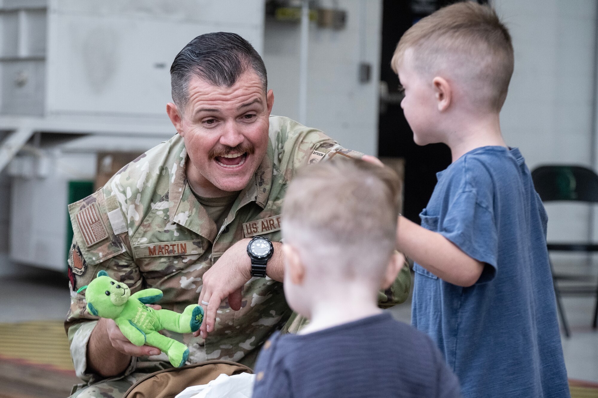 A U.S. Air Force Airman assigned to 4th Fighter Wing reunites with his family after returning from a deployment.
