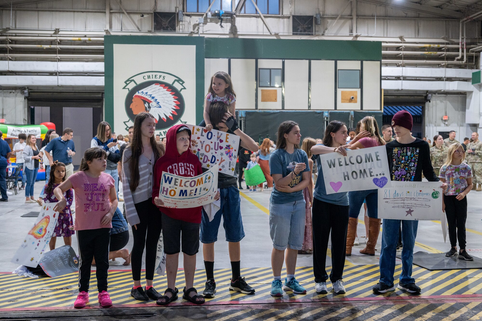 Family and friends wait to welcome back return deployers.