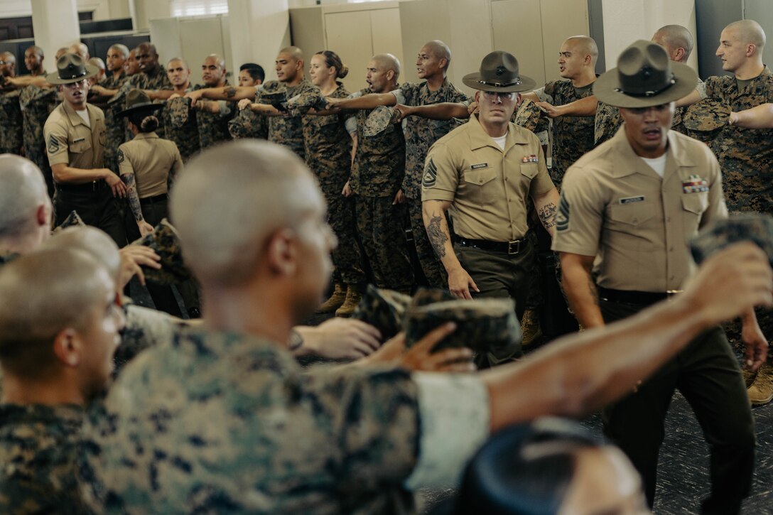 U.S. Marine Corps instructors with Marine Corps Recruit Depot San Diego Drill Instructor School, Recruit Training Regiment, observes the new Marines of DI school class 1-25 at Marine Corps Recruit Depot San Diego, California, Oct. 3, 2024. DI school develops leadership, command presence, instructional ability, physical fitness, and professional knowledge in officers and noncommissioned officers to prepare them for the duties of a drill instructor.  (U.S. Marine Corps photo by Sgt. Jesse K. Carter-Powell)