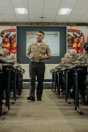 U.S. Marine Corps 1st Sgt. Omar Garcia, the first sergeant of Marine Corps Recruit Depot San Diego Drill Instructor School, Recruit Training Regiment, briefs the new Marines of DI school class 1-25 at Marine Corps Recruit Depot San Diego, California, Oct. 3, 2024. DI school develops leadership, command presence, instructional ability, physical fitness, and professional knowledge in officers and noncommissioned officers to prepare them for the duties of a drill instructor.  (U.S. Marine Corps photo by Sgt. Jesse K. Carter-Powell)