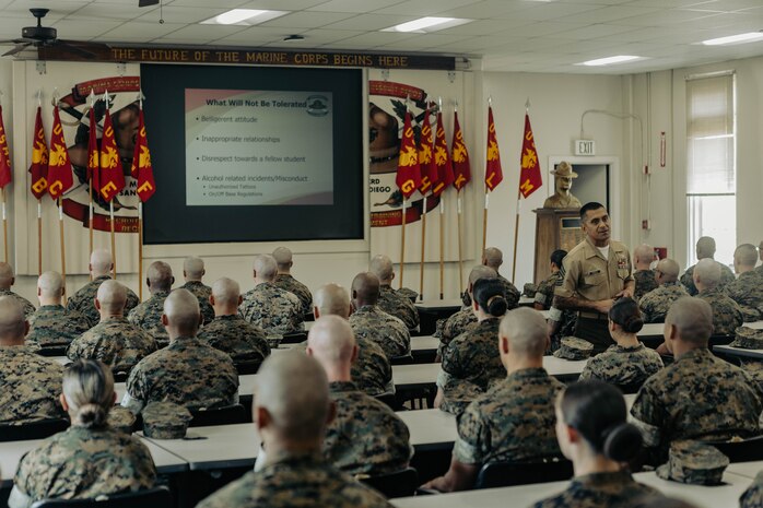 U.S. Marine Corps 1st Sgt. Omar Garcia, the first sergeant of Marine Corps Recruit Depot San Diego Drill Instructor School, Recruit Training Regiment, briefs the new Marines of DI school class 1-25 at Marine Corps Recruit Depot San Diego, California, Oct. 3, 2024. DI school develops leadership, command presence, instructional ability, physical fitness, and professional knowledge in officers and noncommissioned officers to prepare them for the duties of a drill instructor.  (U.S. Marine Corps photo by Sgt. Jesse K. Carter-Powell)