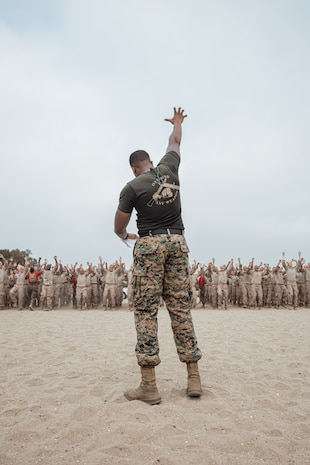 U.S. Marine Corps Martial Arts Instructor, Sgt. Thierno Jalloh, with Support Battalion, Recruit Training Regiment, leads warmup exercises for recruits with Alpha Company, 1st Recruit Training Battalion, before their Marine Corps Martial Arts Program class focusing on bayonet techniques at Marine Corps Recruit Depot San Diego, California, Sept. 30, 2024. MCMAP strengthens the mental and moral resiliency of individual recruits and Marines through realistic combative training, warrior ethos studies, and physical hardening. (U.S. Marine Corps photo by Cpl. Sarah M. Grawcock)
