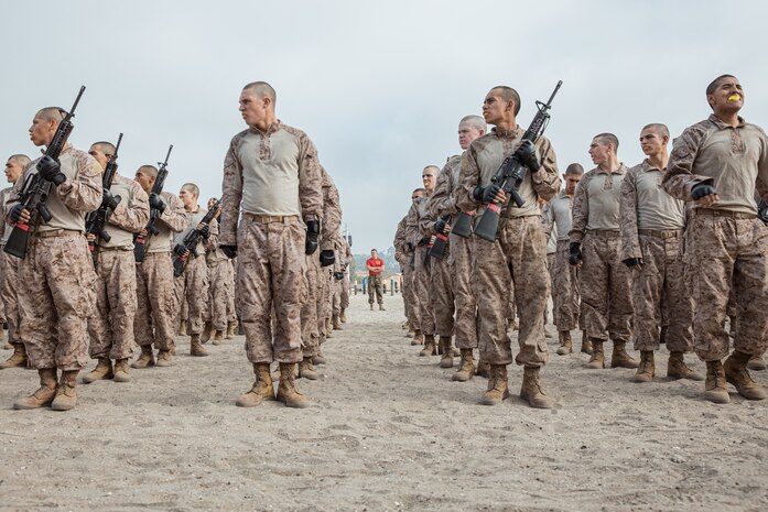 U.S. Marine Corps Capt. Alexander Anbarcioglu, center, a series commander with Alpha Company, 1st Recruit Training Battalion, observes recruits during a Marine Corps Martial Arts Program class focusing on bayonet techniques at Marine Corps Recruit Depot San Diego, California, Sept. 30, 2024. MCMAP strengthens the mental and moral resiliency of individual recruits and Marines through realistic combative training, warrior ethos studies, and physical hardening. (U.S. Marine Corps photo by Cpl. Sarah M. Grawcock)