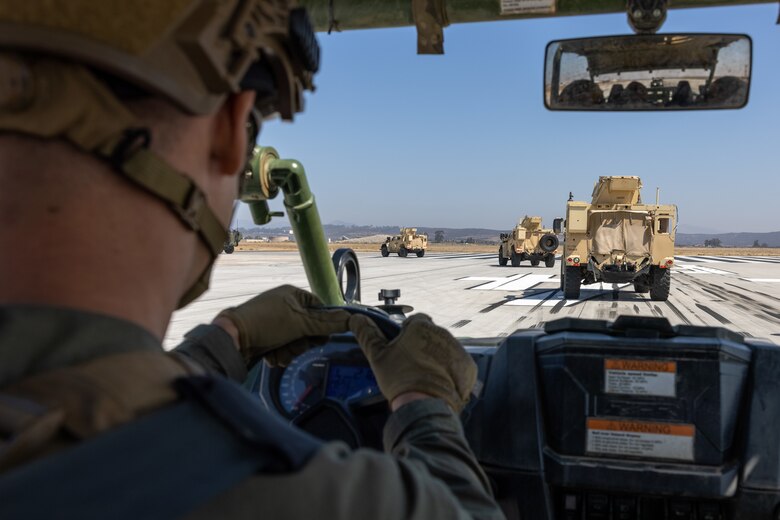 U.S. Marine Corps Sgt. Harley Schnelle, a bulk fuel specialist with 3rd Marine Aircraft Wing, I Marine Expeditionary Force, drives an Ultra-Light Tactical Vehicle during the Marine Air-Ground Task Force demonstration of the 2024 Marine Corps Air Station Miramar Airshow in San Diego, Sept. 27, 2024. The MAGTF Demo displays the coordinated use of close-air support, armor, artillery, and infantry forces and provides a visual representation of how the Marine Corps operates. America's Airshow 2024 is a unique and incredible opportunity to witness Marine and joint aviation capabilities, civilian performers, and the world-famous Blue Angels; to interact first-hand with Marines, other service members, and first responders; and to see first-hand the innovative spirit of the Marine Corps through emerging technologies and forward-thinking. (U.S. Marine Corps photo by Lance Cpl. Jennifer Sanchez)