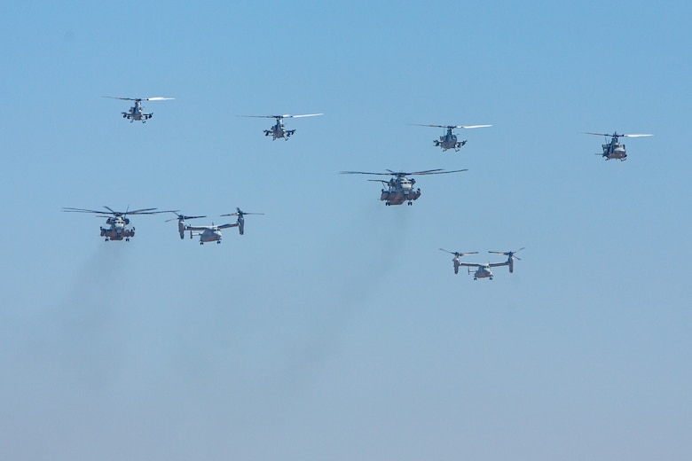 U.S. Marine Corps aircraft assigned to 3rd Marine Aircraft Wing, I Marine Expeditionary Force, conduct a flyover at the end of the Marine Air-Ground Task Force demonstration of the 2024 Marine Corps Air Station Miramar Airshow in San Diego, Sept. 27, 2024. The MAGTF Demo displays the coordinated use of close-air support, armor, artillery, and infantry forces and provides a visual representation of how the Marine Corps operates. America's Airshow 2024 is a unique and incredible opportunity to witness Marine and joint aviation capabilities, civilian performers, and the world-famous Blue Angels; to interact first-hand with Marines, other service members, and first responders; and to see first-hand the innovative spirit of the Marine Corps through emerging technologies and forward-thinking. (U.S. Marine Corps photo by Cpl. Arthur W. Shores)