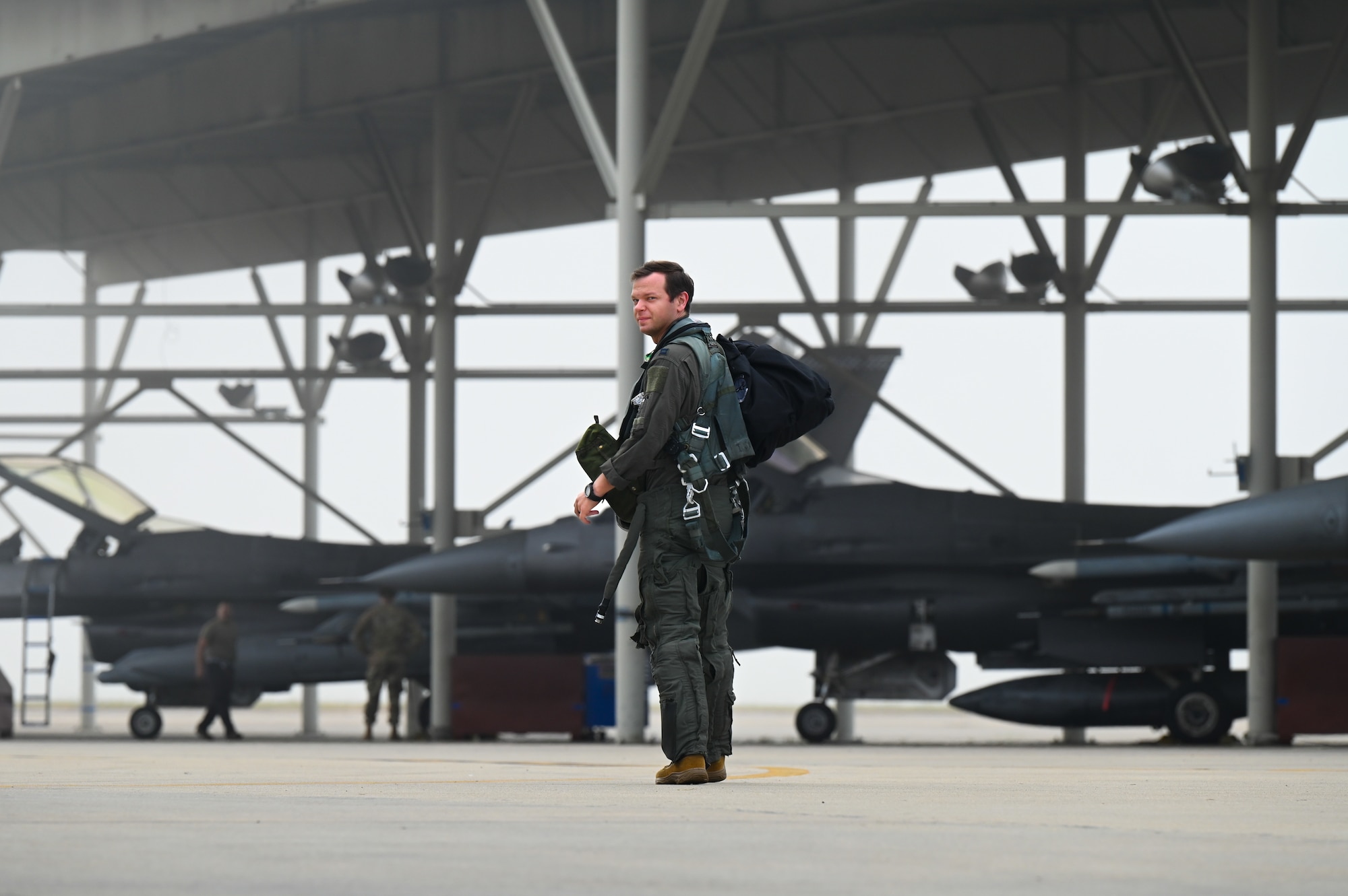 Pilot walking to a jet.