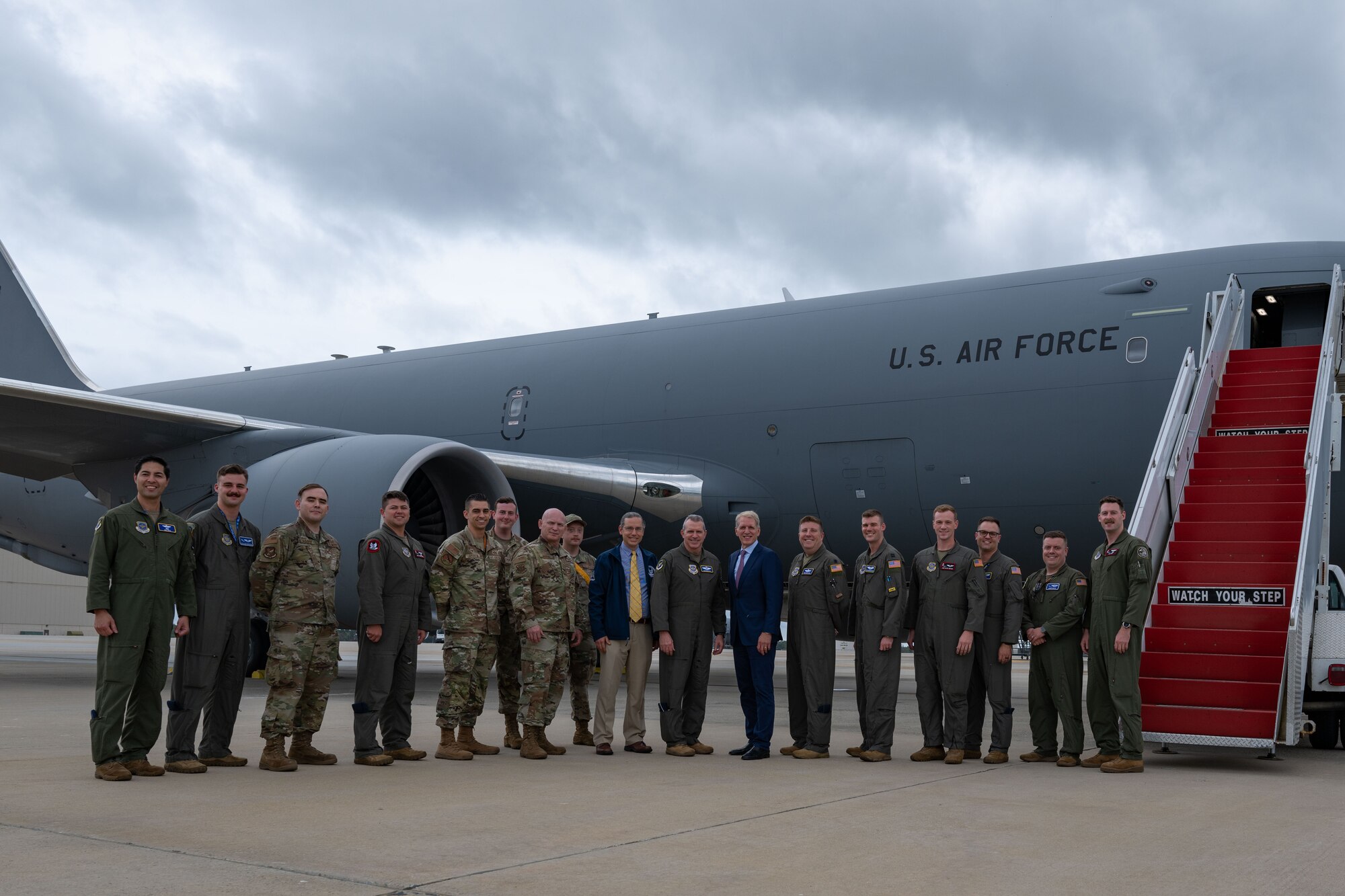 U.S. Air Force Maj. Gen. Charles D. Bolton, 18th Air Force commander, Chief Master Sgt. Thomas Blount, 18th Air Force command chief, Aaron Tucker, Major Defense Acquisition Programs director, and the Honorable Peter Beshar, U.S. Department of the Air Force general counsel, pose for a photo with air crew assigned to the 305th Air Mobility Wing during an east coast introductory base tour at Joint Base McGuire-Dix-Lakehurst, N.J., Sept. 26, 2024. The senior leaders concluded their regional tour with the ‘Can Do’ wing as they visited several bases for the first time since taking command, while Beshar joined the team at JB MDL to gain more insight about the KC-46A Pegasus aircraft fleet and what the jet provides in comparison to legacy tankers. (U.S. Air Force photo by Staff Sgt. Monica Roybal)