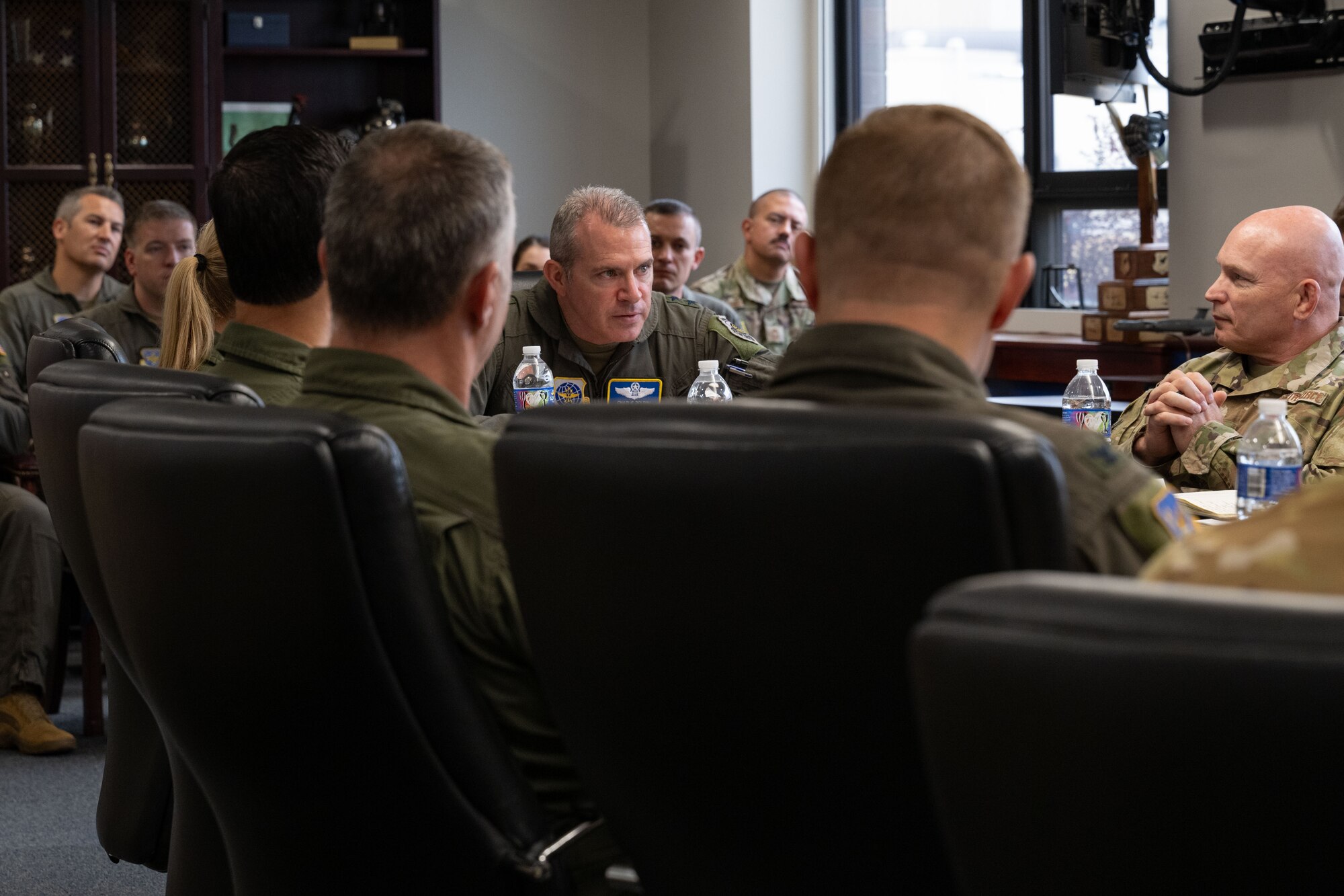 U.S. Air Force Maj. Gen. Charles D. Bolton, 18th Air Force commander, and Chief Master Sgt. Thomas Blount, 18th Air Force command chief, attend a mission briefing hosted by Col. Kathleen M. Hasson, 305th Air Mobility Wing commander, during an east coast introductory base tour at Joint Base McGuire-Dix-Lakehurst, N.J., Sept. 25, 2024. The senior leaders concluded their regional tour with the ‘Can Do’ wing, which also included an air refueling demonstration aboard a KC-46A Pegasus aircraft to gain more insight about the fleet and what the jet provides in comparison to legacy tankers. (U.S. Air Force photo by Staff Sgt. Monica Roybal)