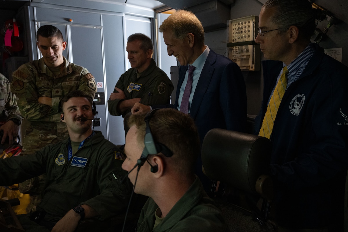 The Honorable Peter J. Beshar, U.S. Department of the Air Force general counsel, U.S. Air Force Maj. Gen. Charles D. Bolton, 18th Air Force commander, and Aaron Tucker, Major Defense Acquisition Programs director, speak with aircrew assigned to the 305th Air Mobility Wing during an east coast introductory base tour at Joint Base McGuire-Dix-Lakehurst, N.J., Sept. 26, 2024. The senior leaders concluded their regional tour with the ‘Can Do’ wing as they visited several bases for the first time since taking command, while Beshar joined the team at JB MDL to gain more insight about the KC-46A Pegasus aircraft fleet and what the jet provides in comparison to legacy tankers. (U.S. Air Force photo by Staff Sgt. Monica Roybal)