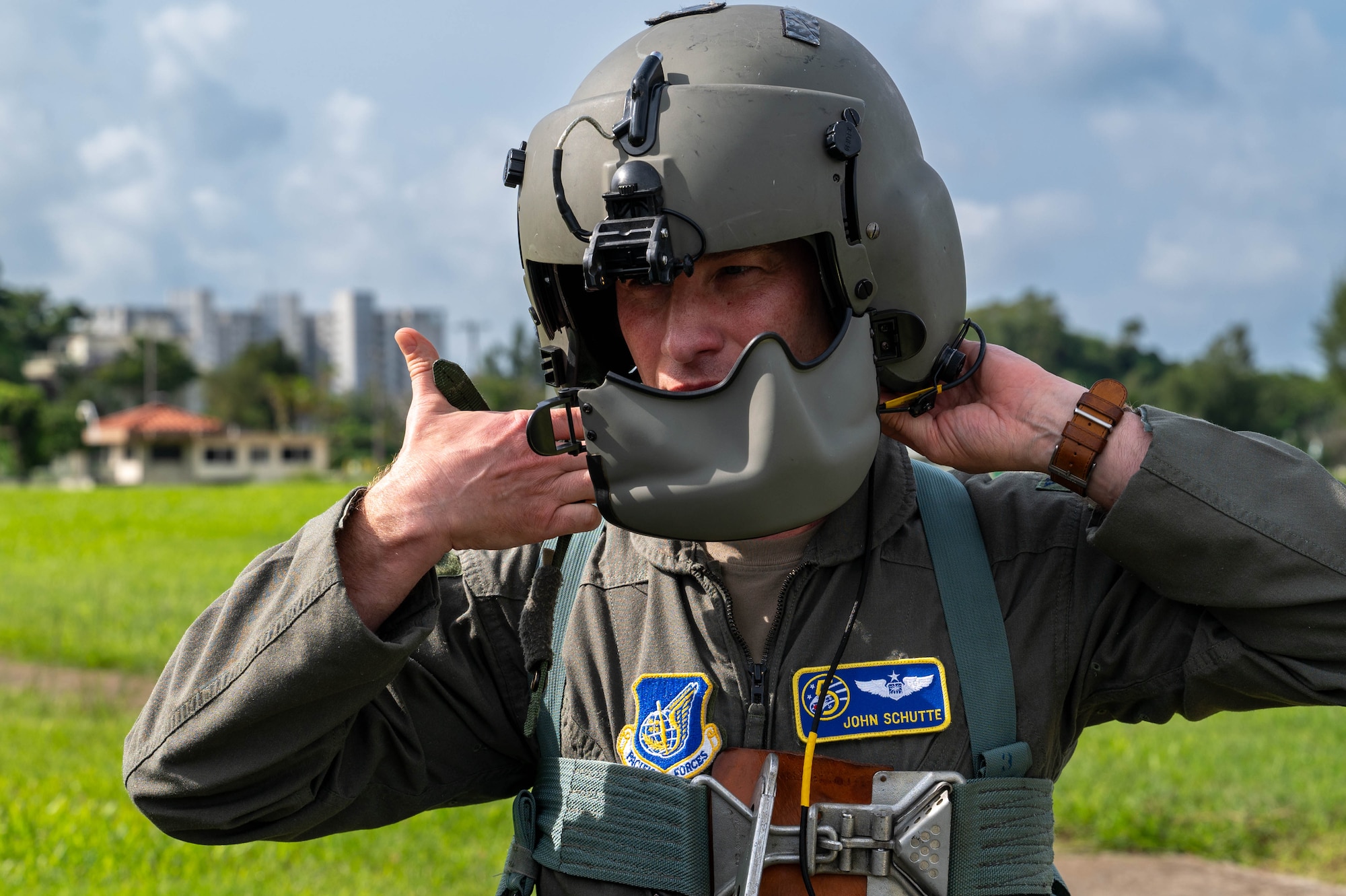 Col. Schutte putting on a flight helmet