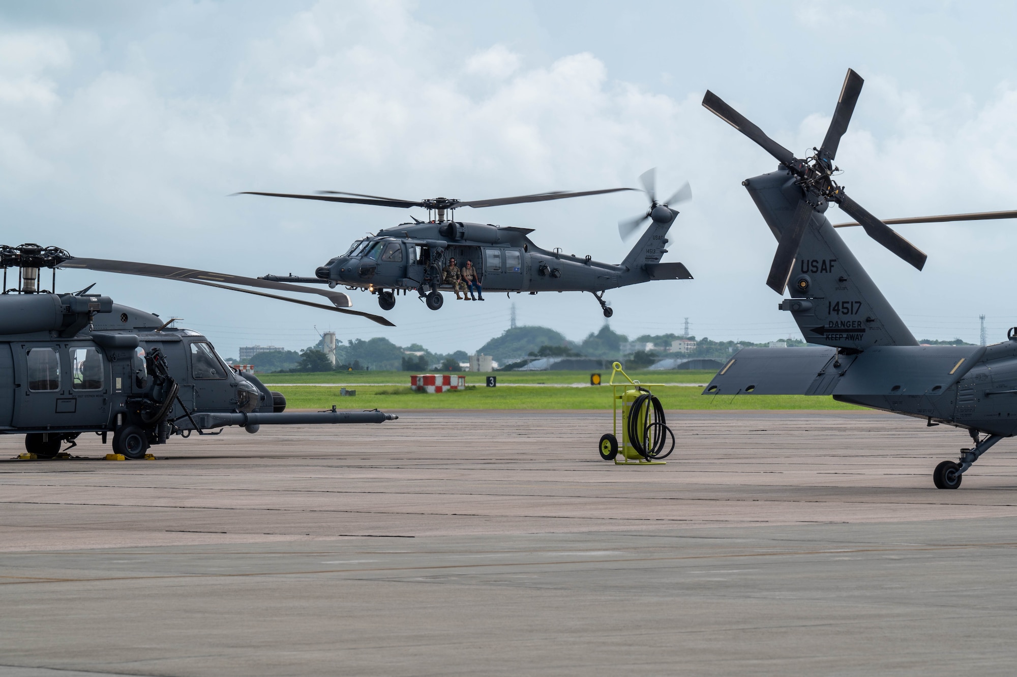 A HH-60W prepares to land on the flightline after a tour