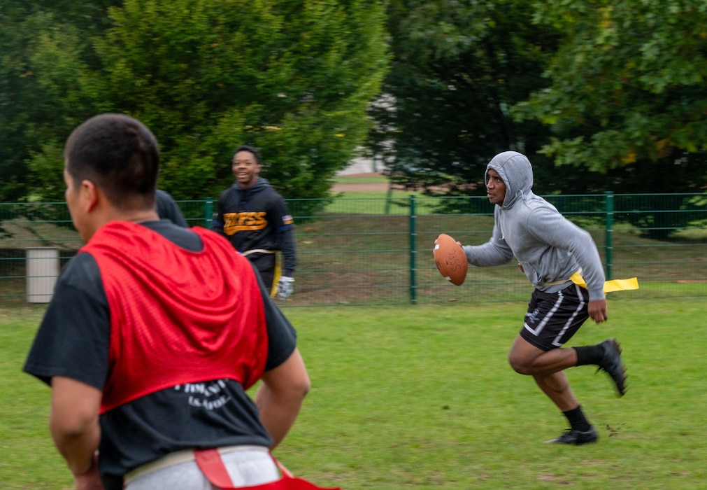 A man runs with a football