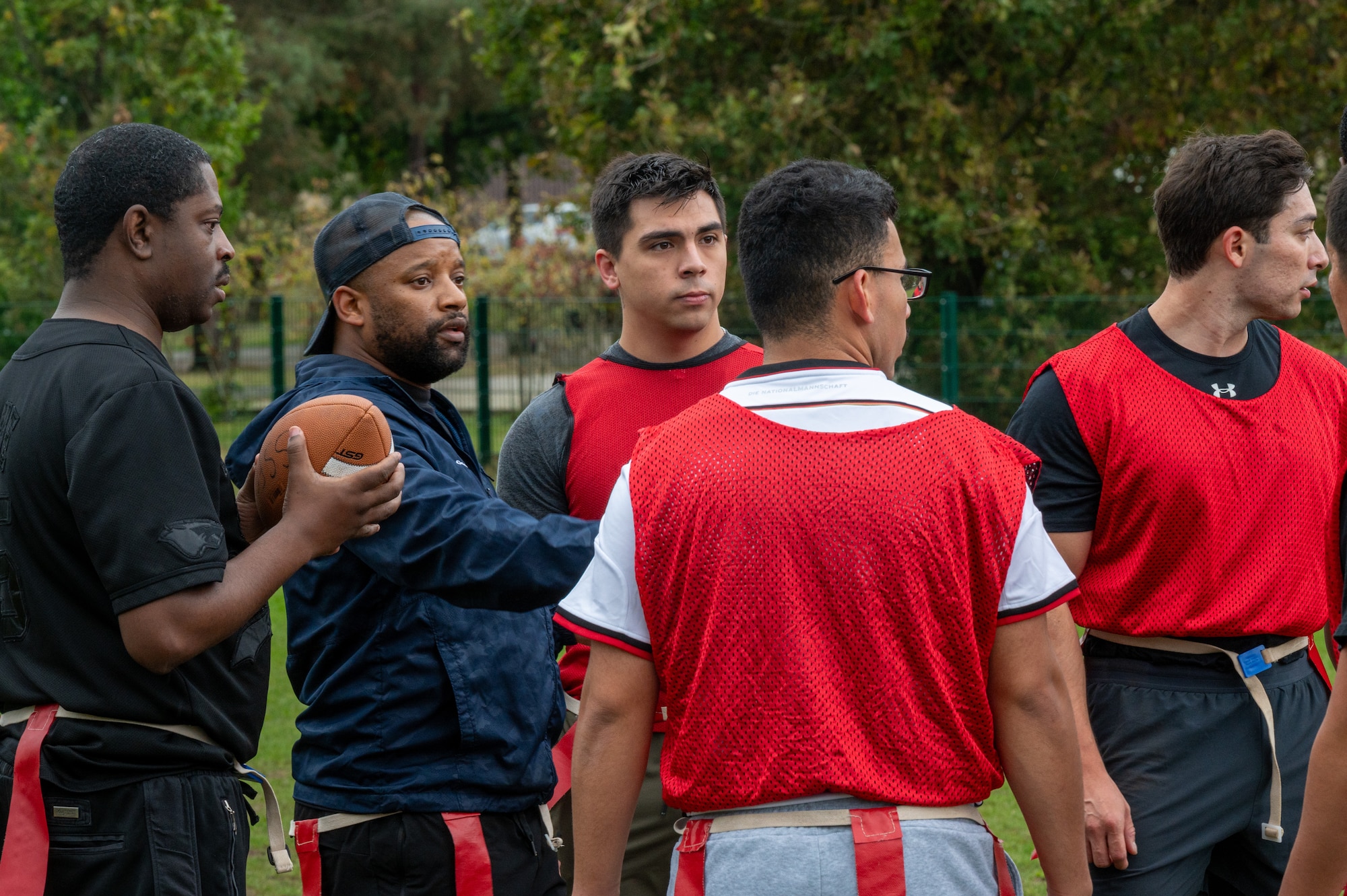 People huddle during a football game