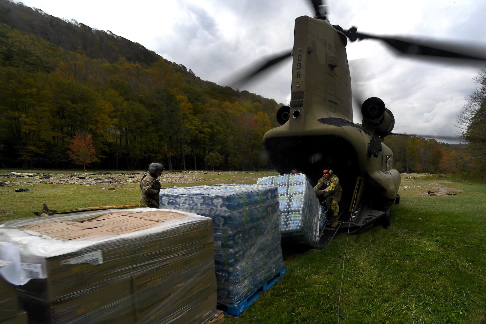 Soldiers with B Company, 2nd Battalion, 238th Aviation Regiment, Ohio Army National Guard, offload food, water and other supplies in western North Carolina  in the aftermath of Hurricane Helene Oct. 4, 2024. National Guard units from multiple states have been taking part in food and water distribution, search and rescue, debris clearance and other tasks as needed.