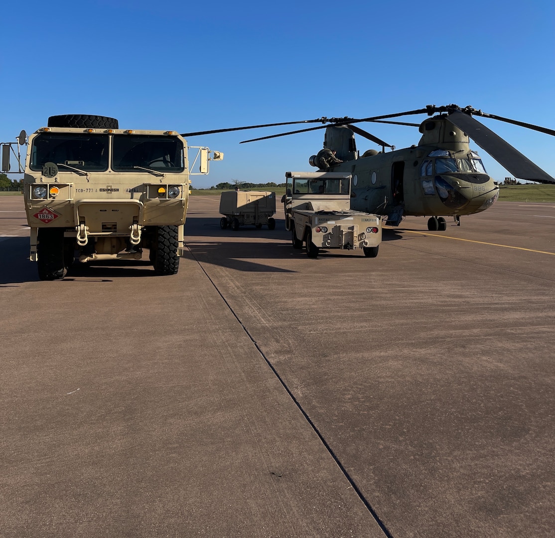 An Oklahoma Army National Guard CH-47 Chinook is readied by Oklahoma National Guard members at the OKARNG Aviation Support Facility in Lexington, Oklahoma, Oct. 6, 2024, before deploying to South Carolina in support of Hurricane Helene relief efforts.