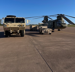 An Oklahoma Army National Guard CH-47 Chinook is readied by Oklahoma National Guard members at the OKARNG Aviation Support Facility in Lexington, Oklahoma, Oct. 6, 2024, before deploying to South Carolina in support of Hurricane Helene relief efforts.