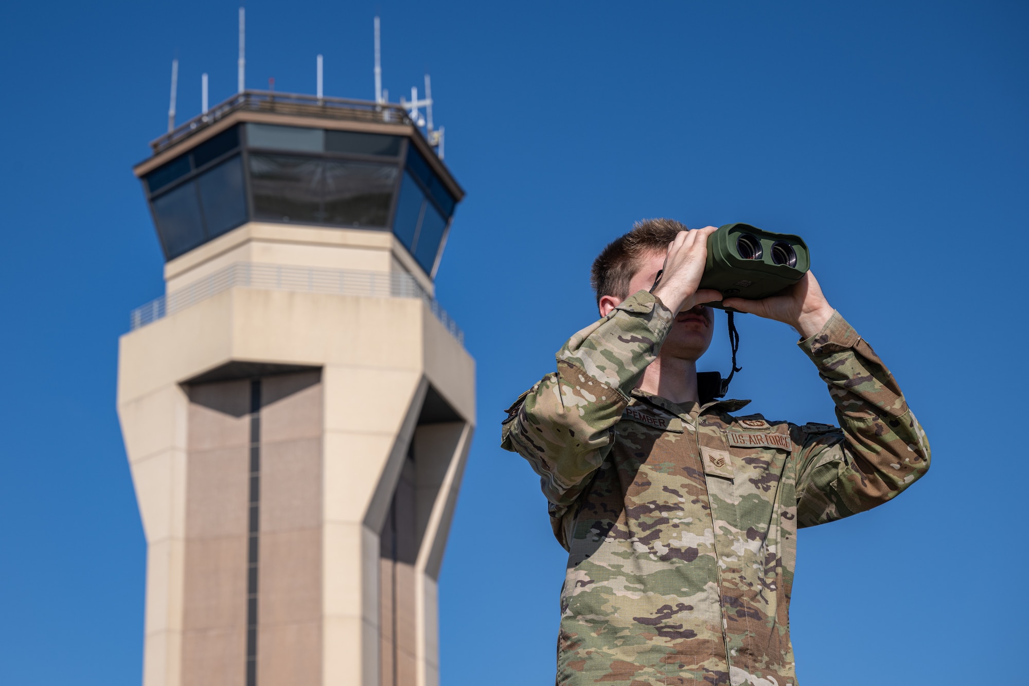 An Airman uses a piece of equipment to help forecast weather