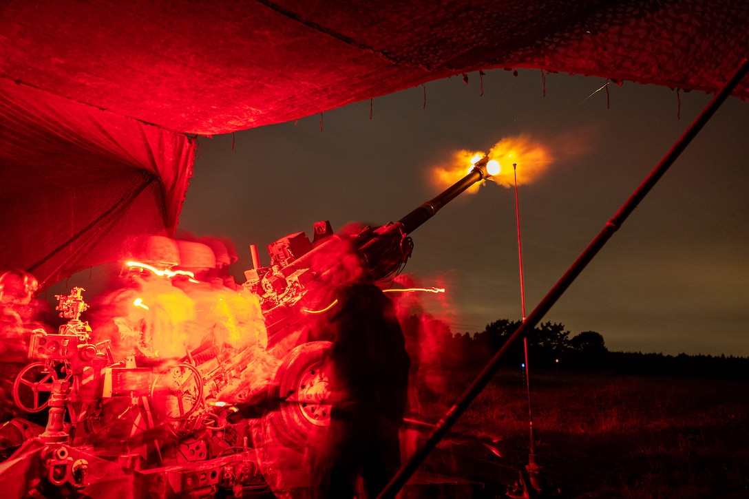 Marines fire an M777 Howitzer while executing night operations during training in Hokkaido, Japan, Sept. 14, 2024.