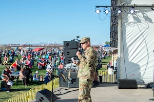 Col. Michael Power, 377th Air Base Wing and installation commander, introduces the U.S. Air Force Academy pop group Blue Delta and the International Balloon Fiesta, on Oct. 5 in Albuquerque, N.M.  The International Balloon Fiesta is an annual event held in Albuquerque and features balloons from across the globe. (U.S. Air Force photo by Mr. Allen Winston)