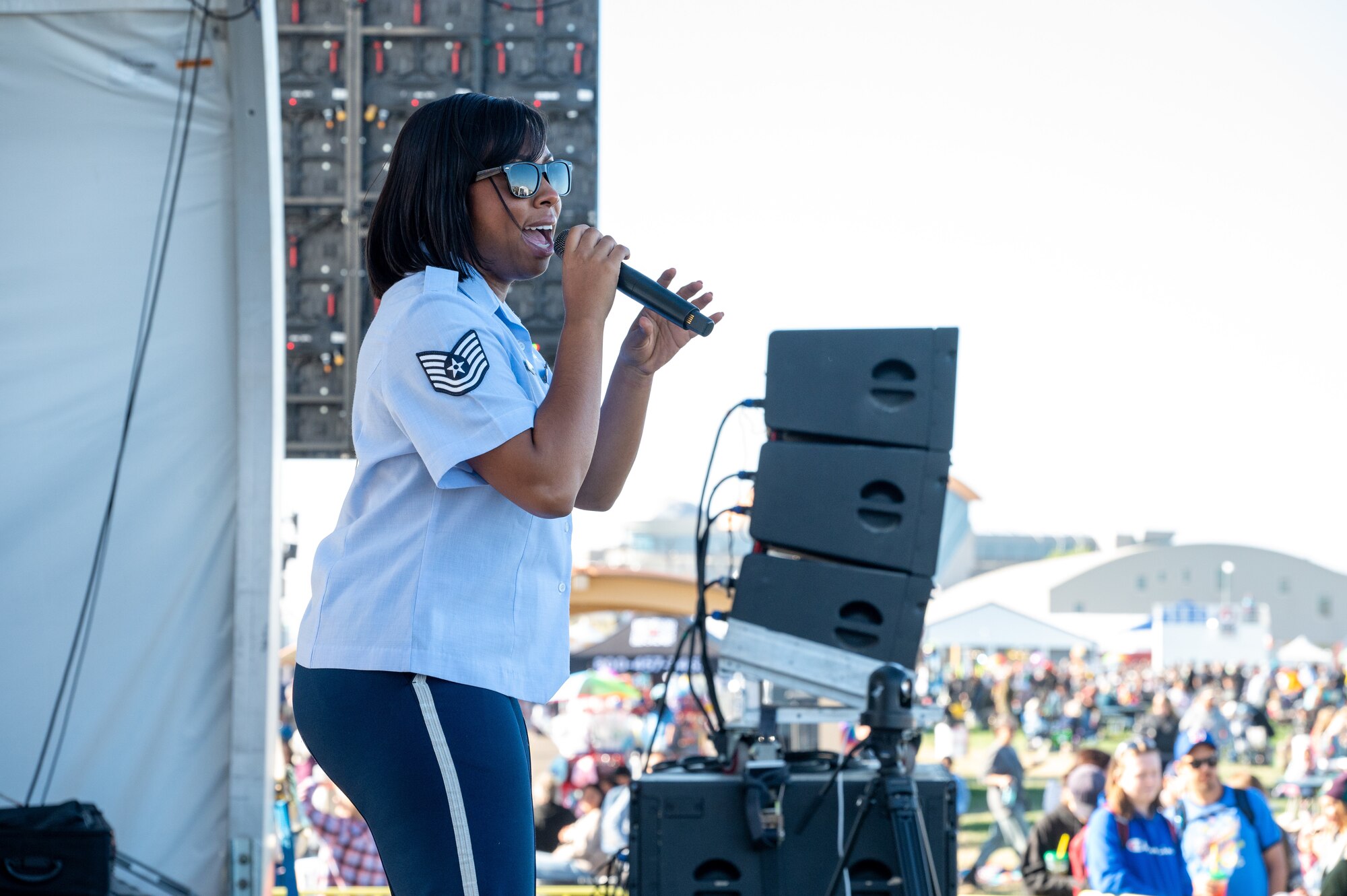 U.S. Air Force Tech. Sgt. Serenity Holloway, U.S. Air Force Academy Band vocalist, sings during a concert at the International Balloon Fiesta, Oct. 5 in Albuquerque, N.M. The International Balloon Fiesta is an annual event held in Albuquerque and features balloons from across the globe. (U.S. Air Force photo by Airman 1st Class Donnell Schroeter)