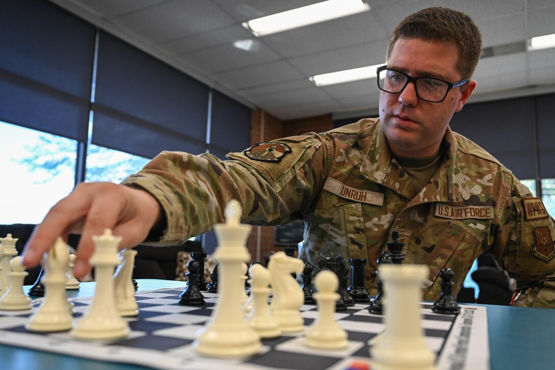 Airman performs chess drills on his professional chess set.