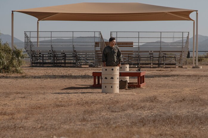 U.S. Marine Corps Cpl. Isaac Ace, a primary marksmanship instructor with Weapons and Field Training Battalion, Recruit Training Regiment, observes recruits during a grass week event at Marine Corps Base Camp Pendleton, California, Sept. 4, 2024. Recruits participated in grass week to hone their marksmanship skills by getting adjusted to their rifle’s equipment and sighting in on mock targets before moving on to the range for rifle qualification. (U.S. Marine Corps photo by Cpl. Elliott A. Flood-Johnson)