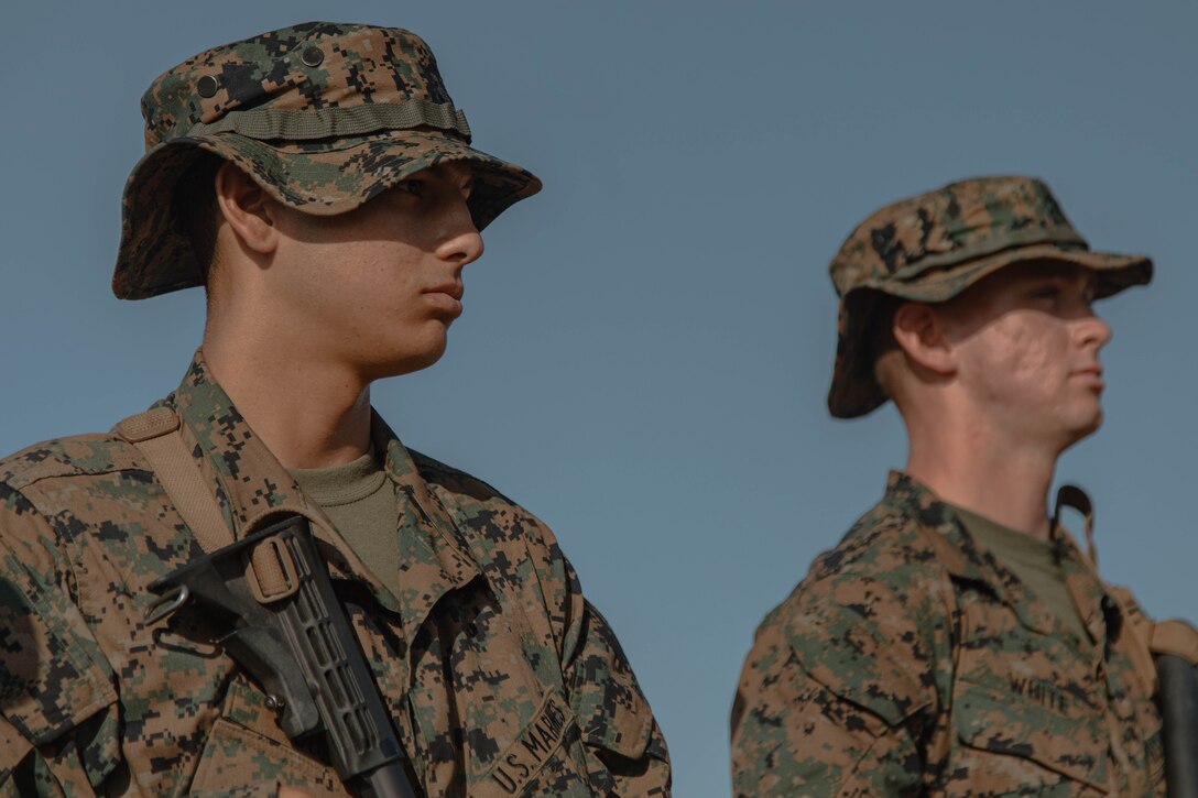 U.S. Marine Corps Recruits Ronnie Gula, left, and Tyler White, right, recruits with Bravo Company, 1st Recruit Training Battalion, stand with their rifles during a grass week event at Marine Corps Base Camp Pendleton, California, Sept. 4, 2024. Recruits participated in grass week to hone their marksmanship skills by getting adjusted to their rifle’s equipment and sighting in on mock targets before moving on to the range for rifle qualification. Gula was recruited out of Recruiting Station San Diego and White was recruited out of Recruiting Station San Diego. (U.S. Marine Corps photo by Cpl. Elliott A. Flood-Johnson)