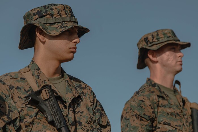 U.S. Marine Corps Recruits Ronnie Gula, left, and Tyler White, right, recruits with Bravo Company, 1st Recruit Training Battalion, stand with their rifles during a grass week event at Marine Corps Base Camp Pendleton, California, Sept. 4, 2024. Recruits participated in grass week to hone their marksmanship skills by getting adjusted to their rifle’s equipment and sighting in on mock targets before moving on to the range for rifle qualification. Gula was recruited out of Recruiting Station San Diego and White was recruited out of Recruiting Station San Diego. (U.S. Marine Corps photo by Cpl. Elliott A. Flood-Johnson)