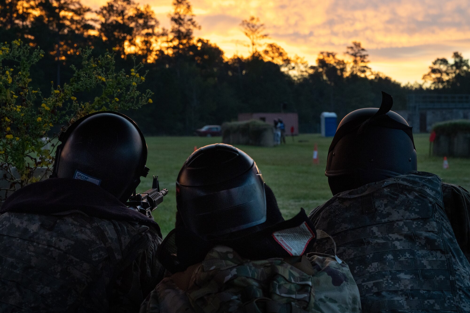 Three Airmen defend an entry control point